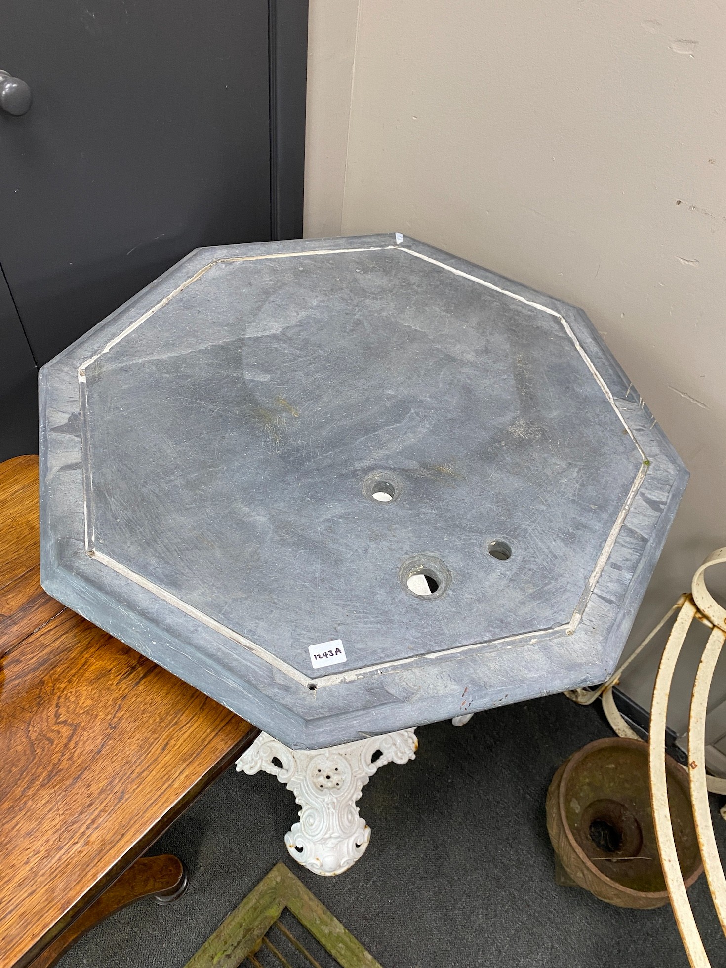 A Victorian octagonal cast iron slate top table, width 70cm, height 81cm
